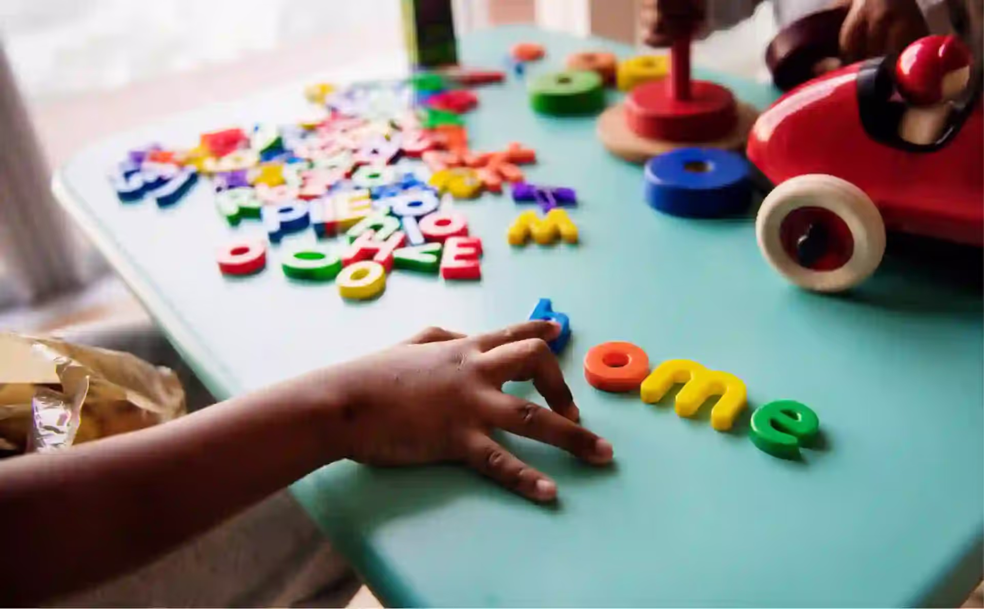 Bilingual Learning with Magnetic Tiles: Alphabet & Language Games